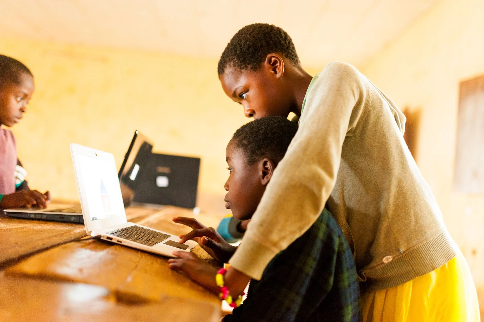Schoolchildren learning together in a classroom