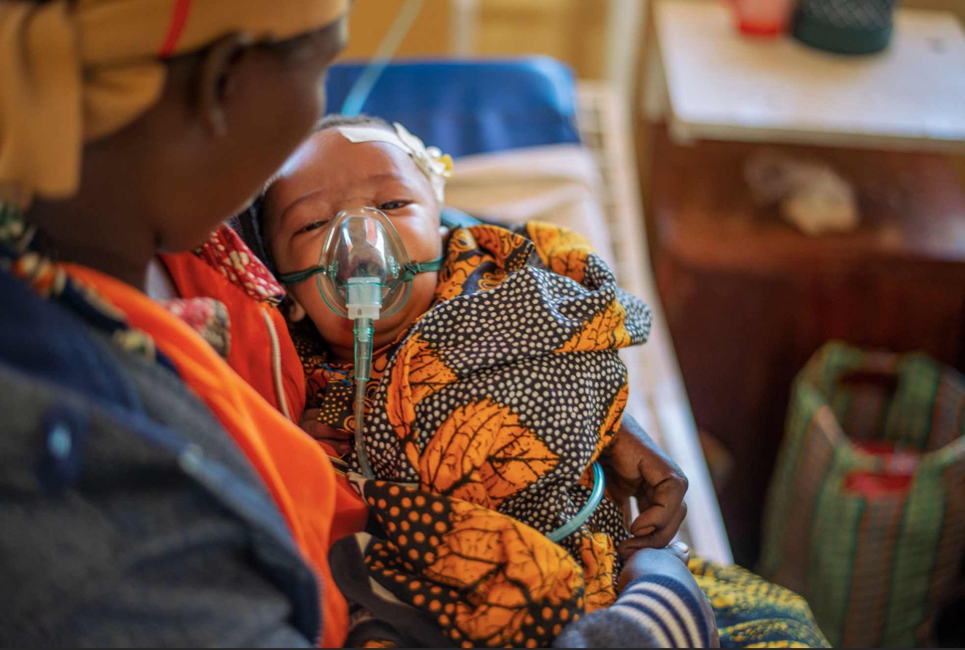 BABY DICKSON RECEIVING OXYGEN FROM A CONCENTRATOR IN DONGABESH, TANZANIA FROM FRE02, AN OXYGEN COLAB GRANTEE