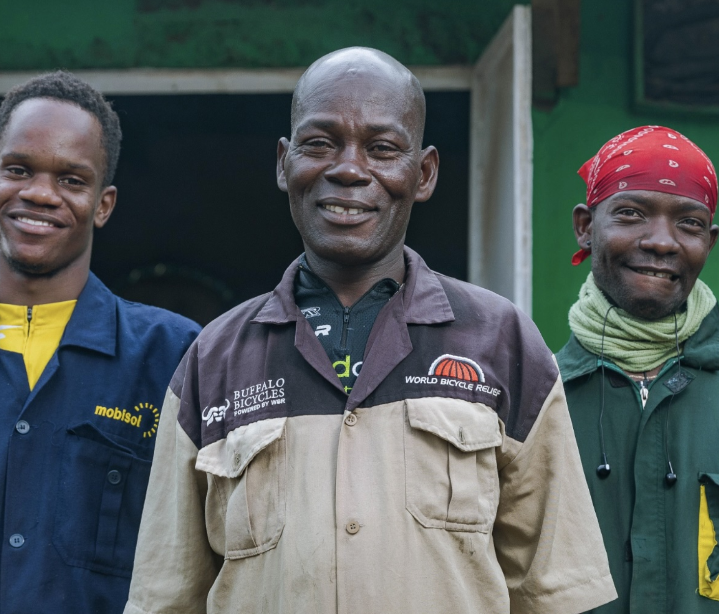 Three repairers from bicycle and solar-energy networks in Kenya